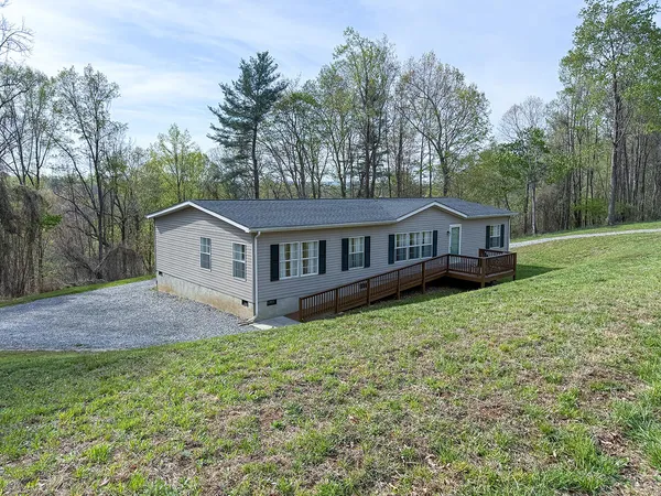 a house with trees in the background