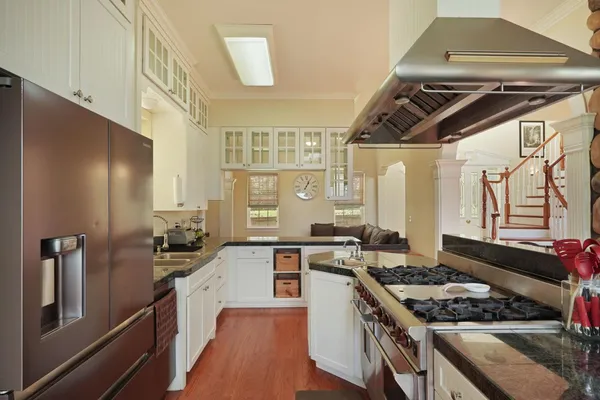 a kitchen with granite countertop a sink and a window