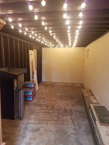 a view of a room with lots of stuff and hardwood floor