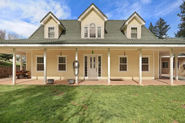 a front view of a house with a yard