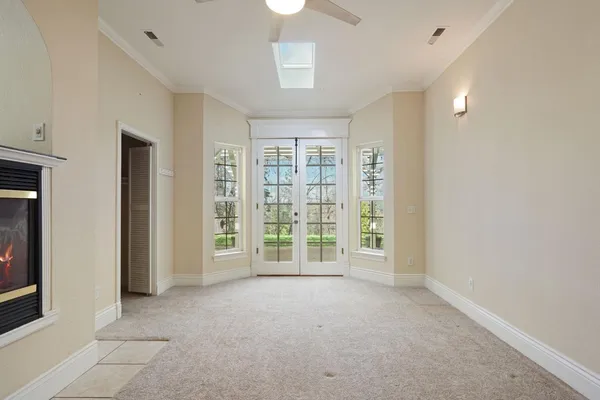 a view of an empty room with a window