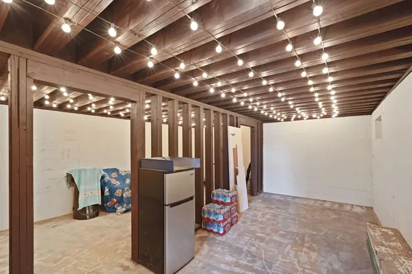 a bathroom with a granite countertop sink toilet a shower and a mirror