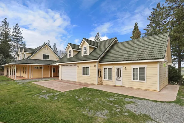 a front view of a house with a yard