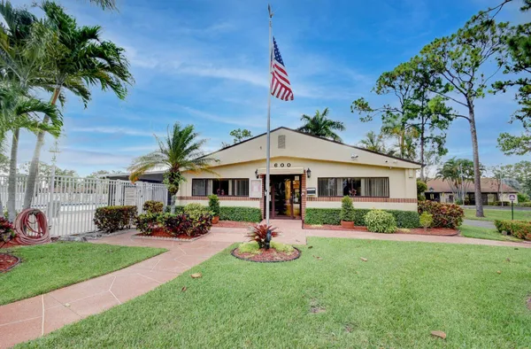 a view of a house with a yard porch and sitting area