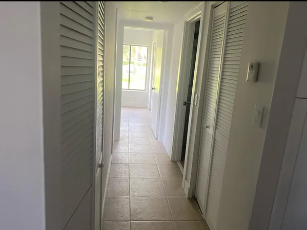 a view of a bathroom from a hallway