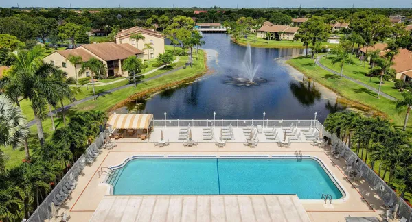 an aerial view of a house with a yard basket ball court