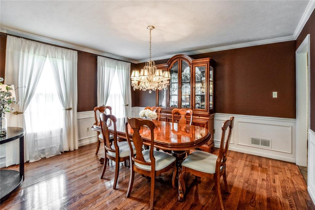 322 Stoup Road Mars, PA 16046 - Photo 13 of 25 a view of a dining room with furniture window and wooden floor