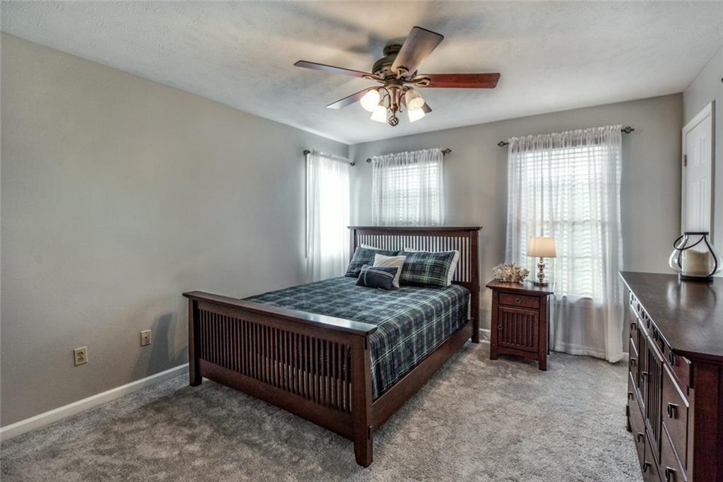 322 Stoup Road Mars, PA 16046 - Photo 20 of 25 a bedroom with a bed and a chandelier