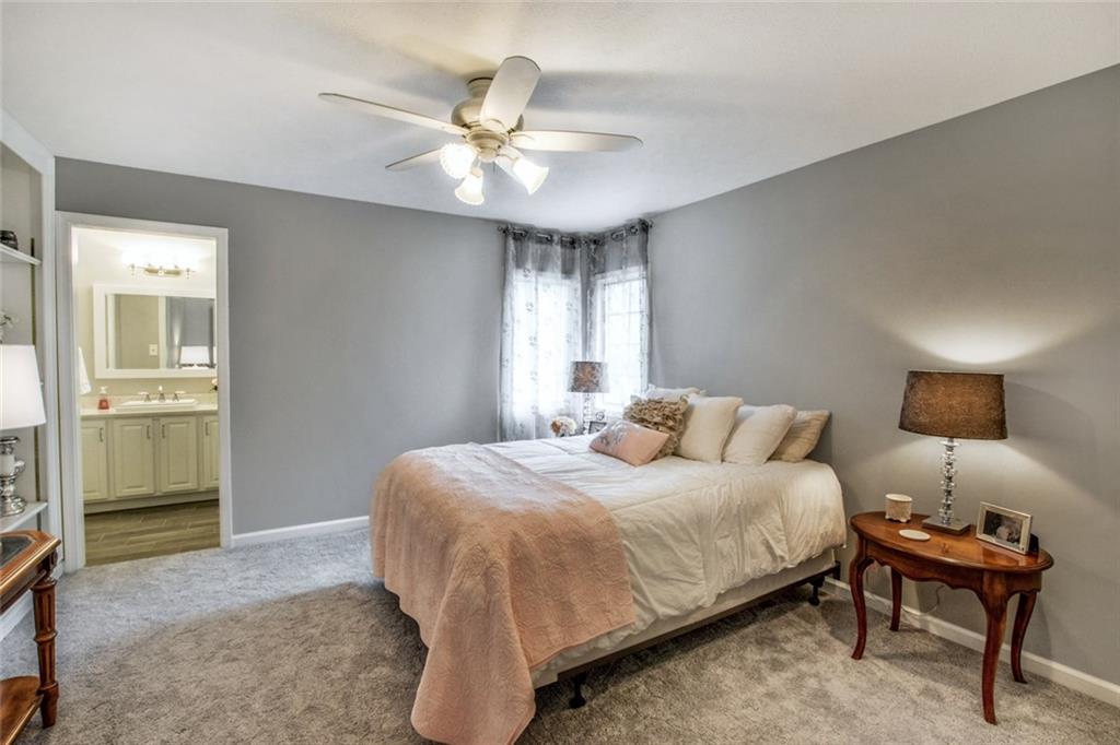 322 Stoup Road Mars, PA 16046 - Photo 21 of 25 a bedroom with a bed and a chandelier