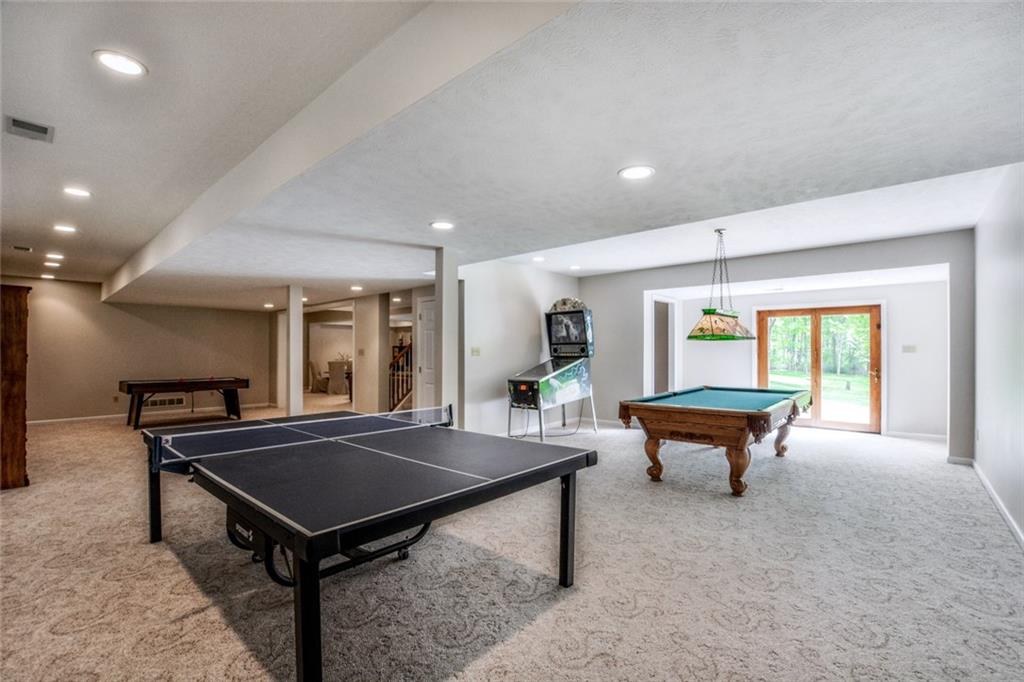 322 Stoup Road Mars, PA 16046 - Photo 23 of 25 a room with furniture pool table table tennis table and a wooden floor
