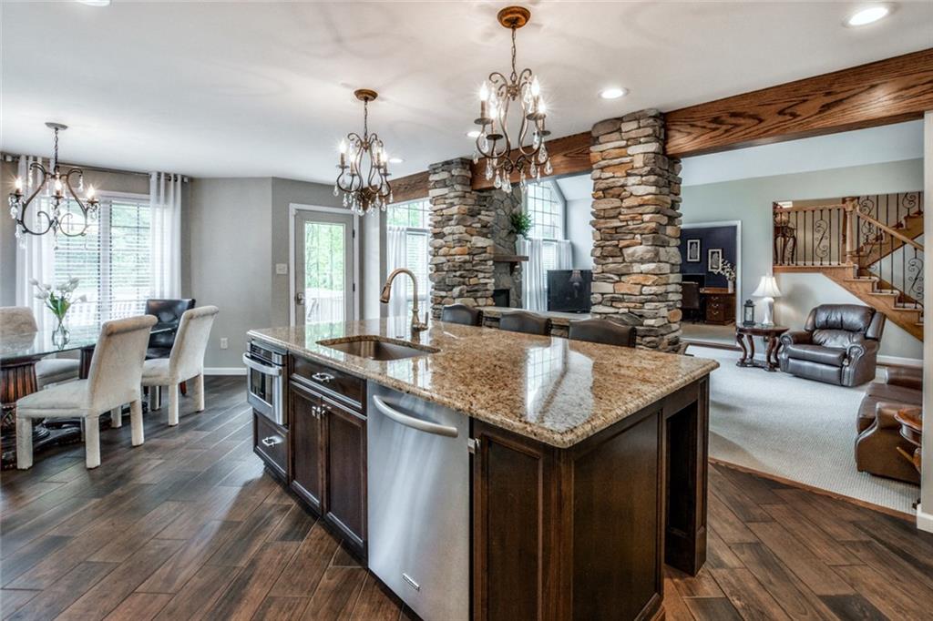 322 Stoup Road Mars, PA 16046 - Photo 3 of 25 a kitchen with granite countertop center island and stainless steel appliances