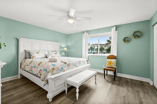 a bed room with a bed and a chair