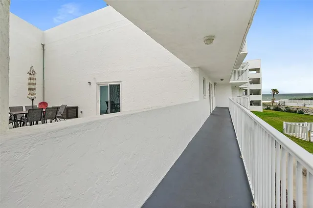 a view of a living room and a balcony