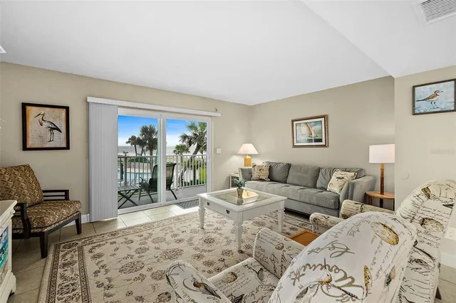 a living room with furniture and a rug