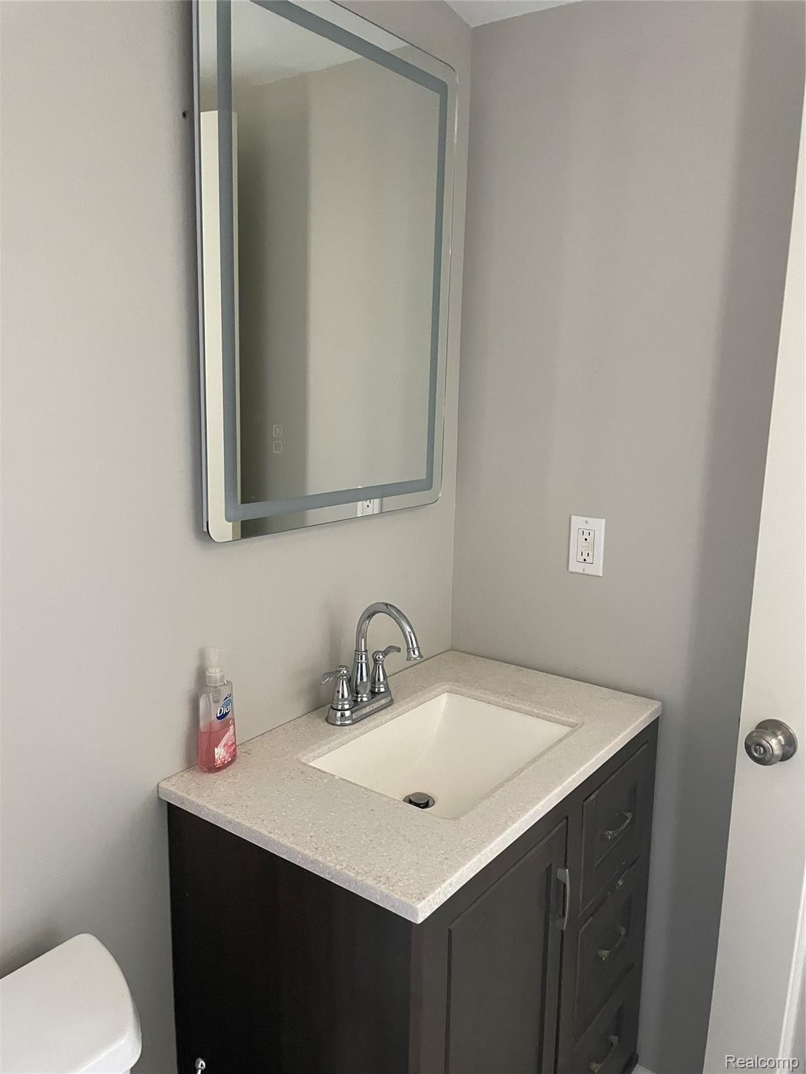 4155 North Center Road Flint, MI 48506 - Photo 13 of 34 Vanity with lighted mirror