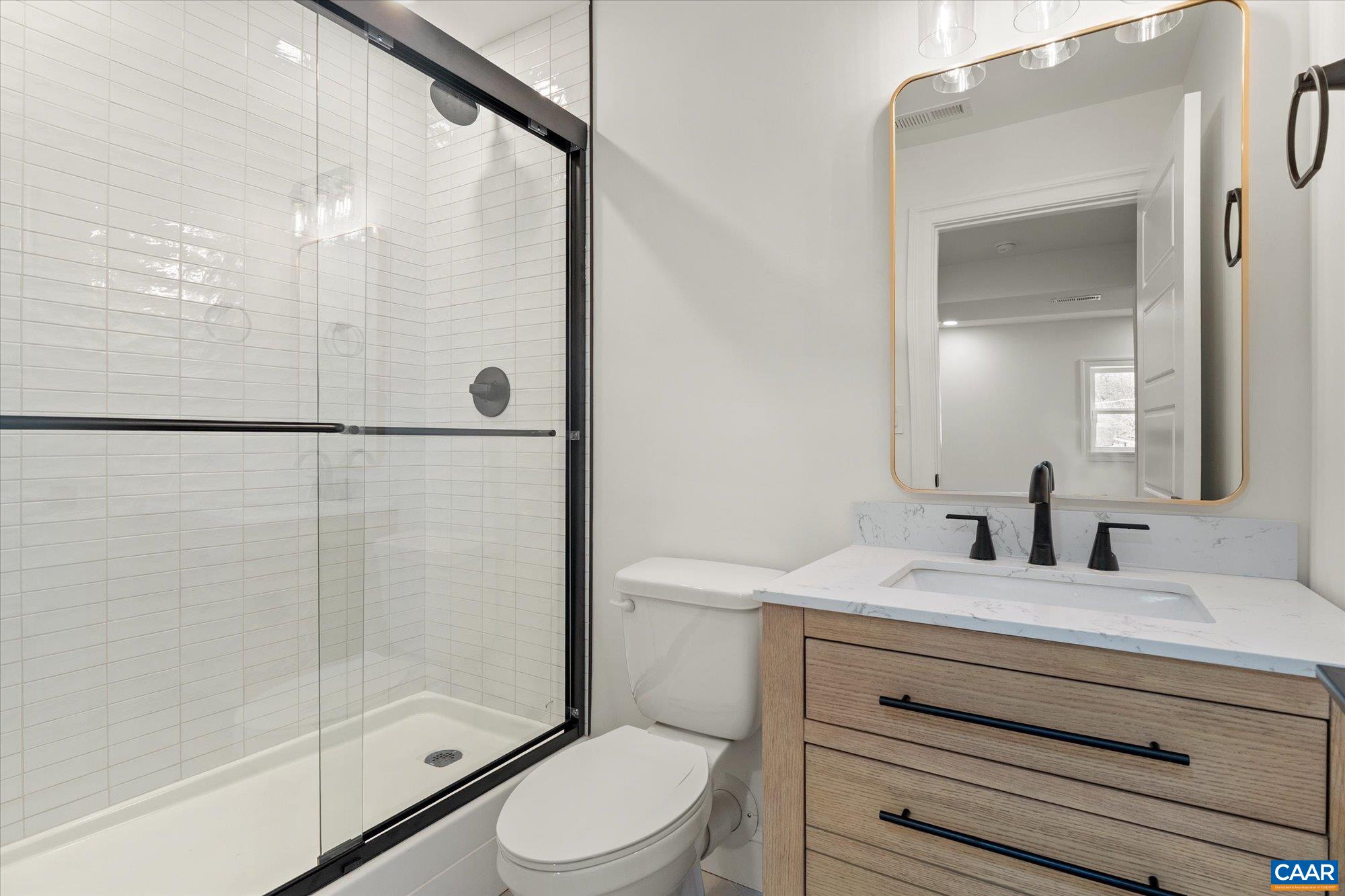1449 Rutledge Avenue Charlottesville, VA 22903 - Photo 33 of 46 a bathroom with a sink a toilet and shower