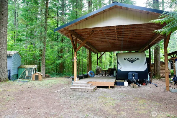 a view of a chairs and table in the patio