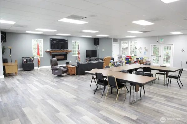 a view of a dining room with furniture window and wooden floor