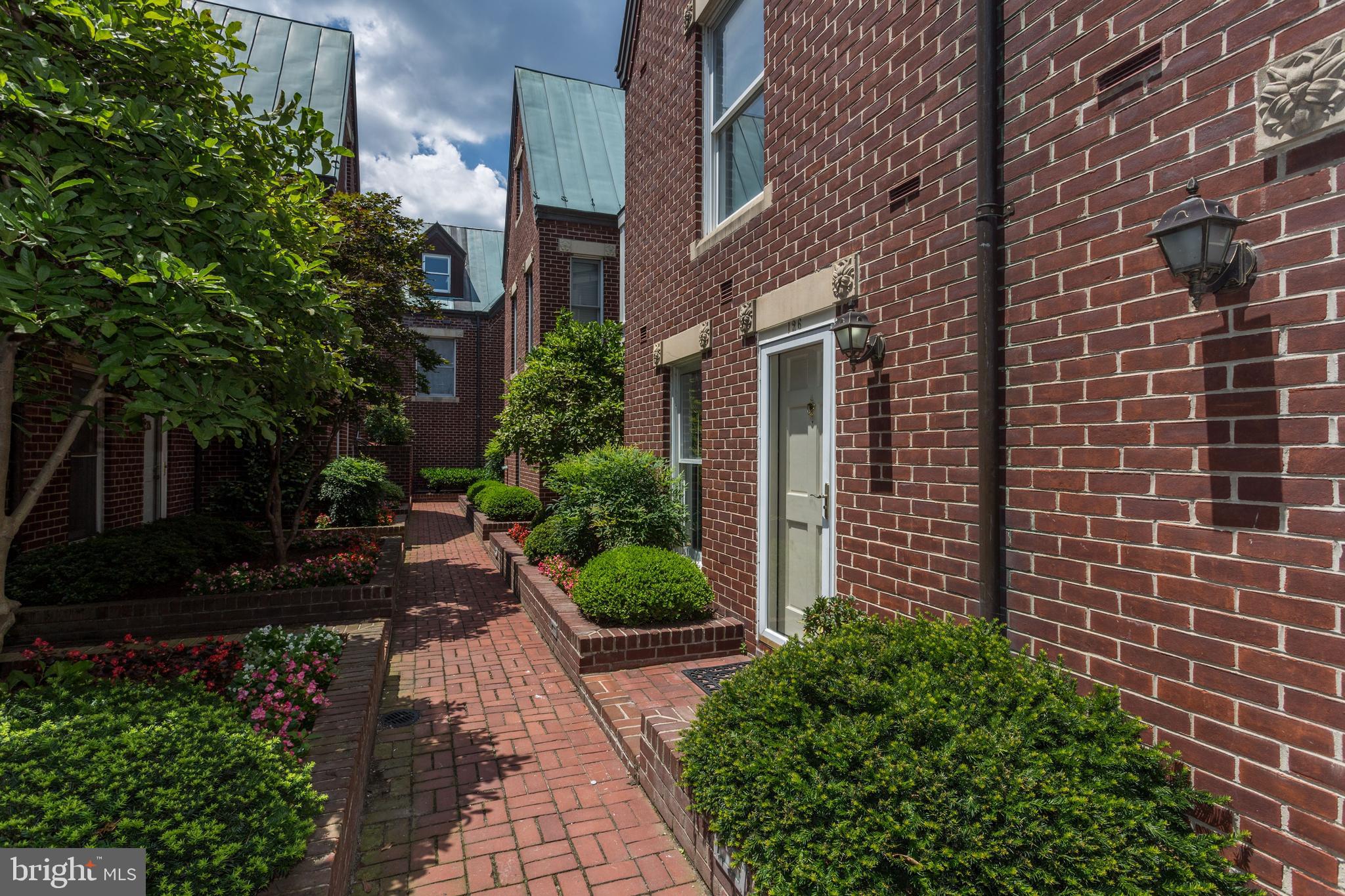 136 North Union Street Alexandria, VA 22314 - Photo 1 of 31 a view of a pathway both side of house