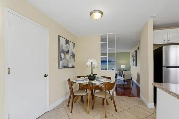 a dining room with furniture and window