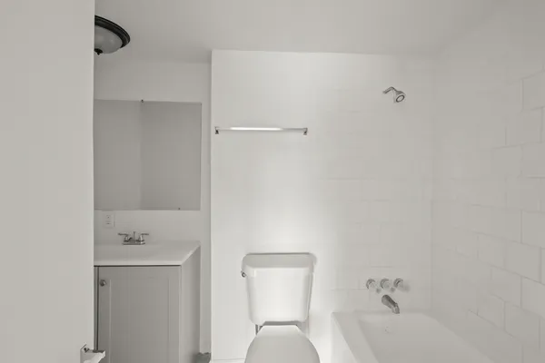 a bathroom with a bathtub and a sink