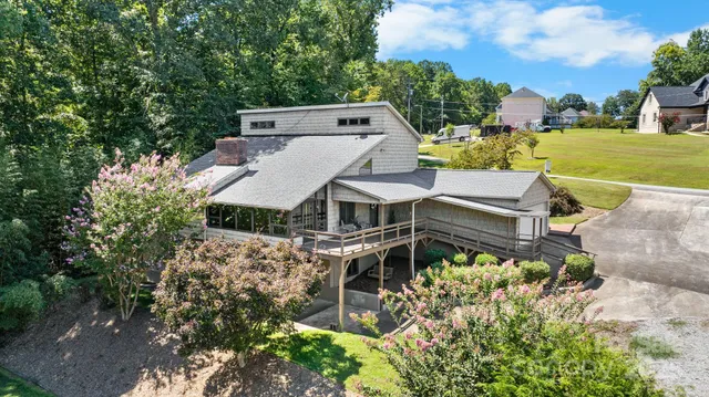 an aerial view of a house with a big yard