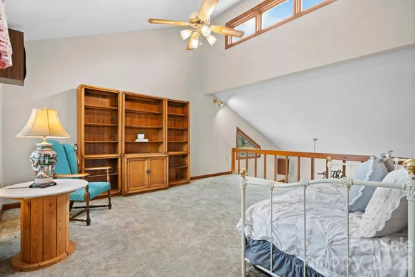 a bedroom with furniture and a window