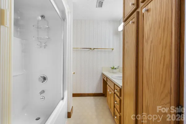 a bathroom with a bathtub and a shower