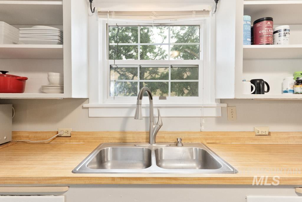 259 Highway 12 Pomeroy, WA 99347 - Photo 13 of 45 Kitchen sink with a contemporary pull-down faucet, set into a light wood-finish countertop