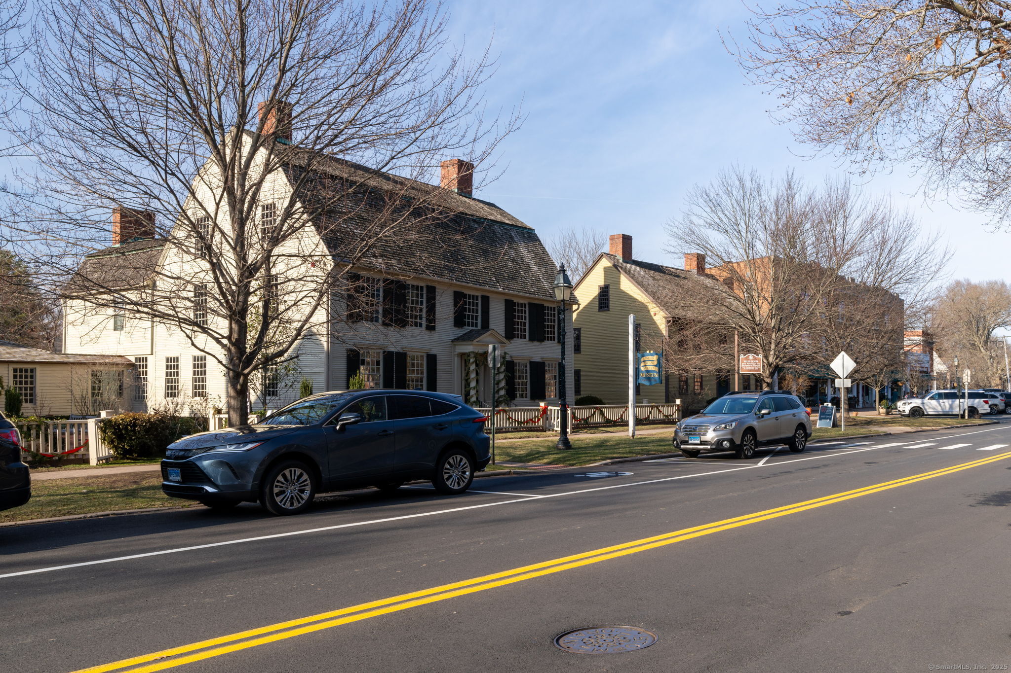 18 Hubbard Place Wethersfield, CT 06109 - Photo 21 of 21 a building with trees in front of it
