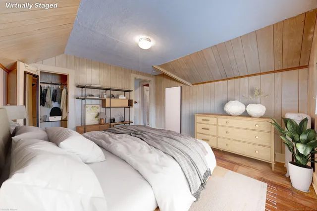 a bedroom with a bed and a cabinets