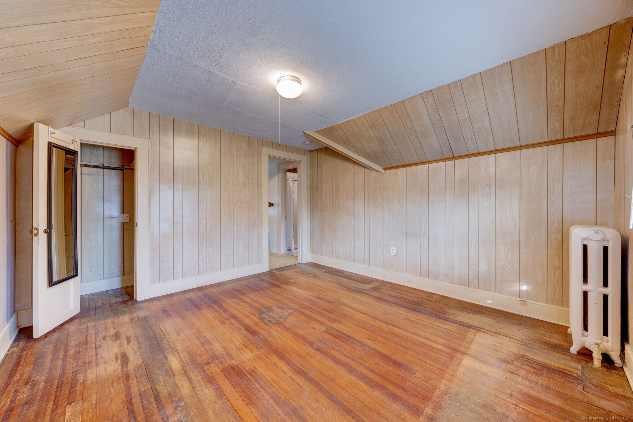 18 Hubbard Place Wethersfield, CT 06109 - Photo 7 of 21 a view of an empty room with wooden floor