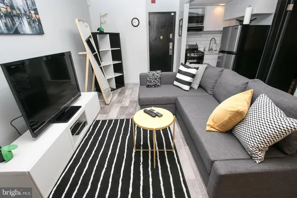 a view of a living room with furniture