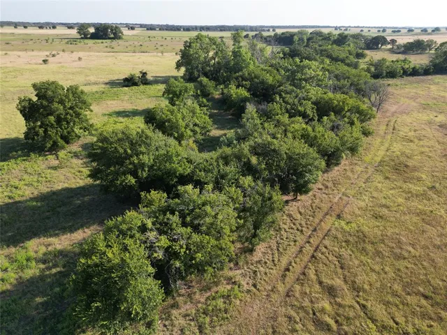 a view of a lake with beach and city view