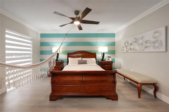 a living room with a mirror and a flat screen tv