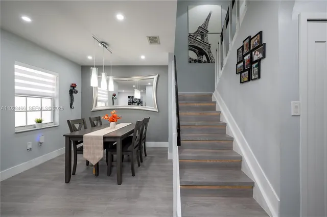 a dining room with furniture and entryway