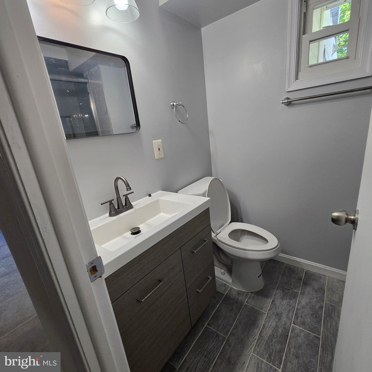 3505 Templar Road Randallstown, MD 21133 - Photo 30 of 40 a white toilet sitting next to a bathroom sink