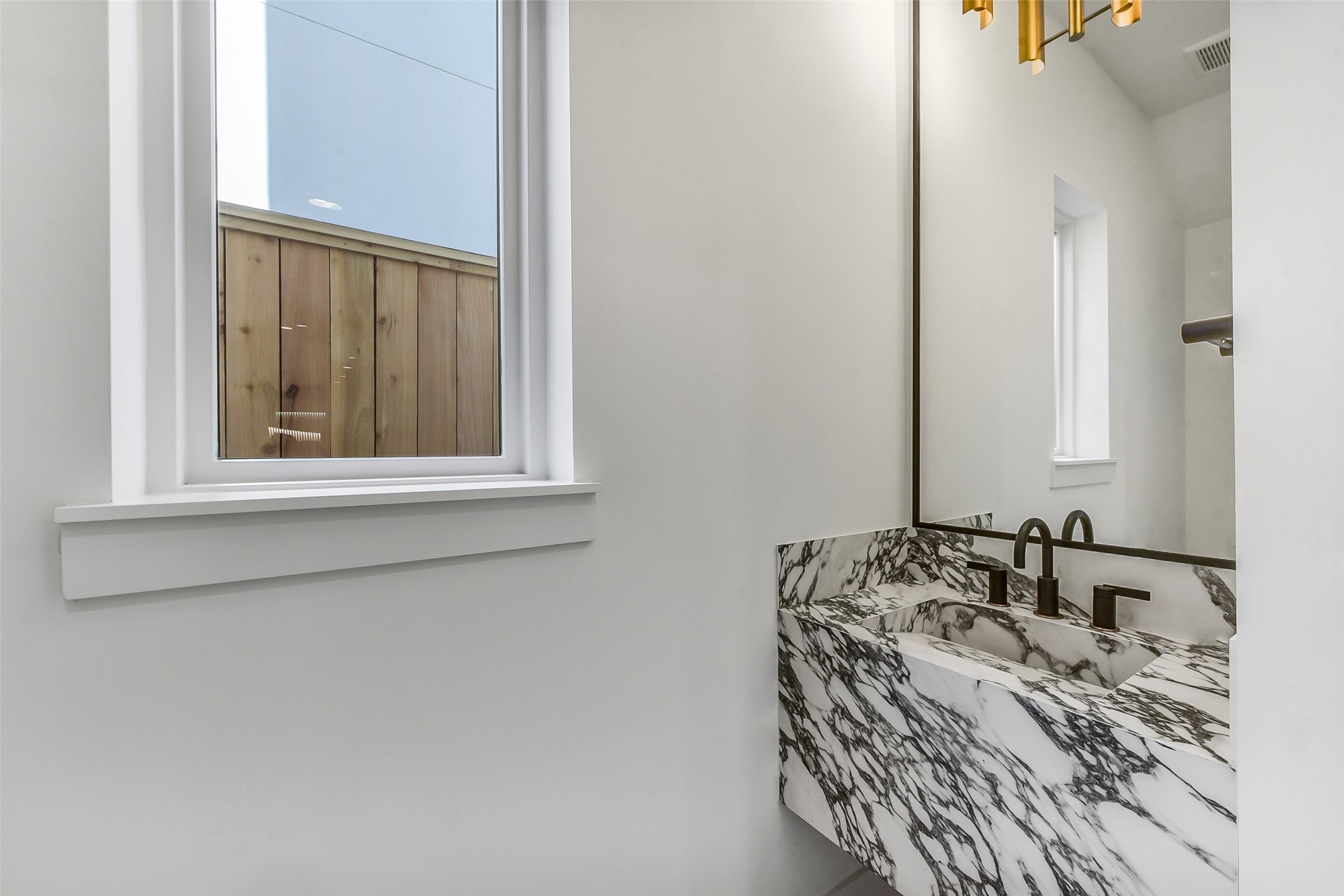 1902 Nantucket Drive Houston, TX 77057 - Photo 11 of 50 a bathroom with a sink and a mirror