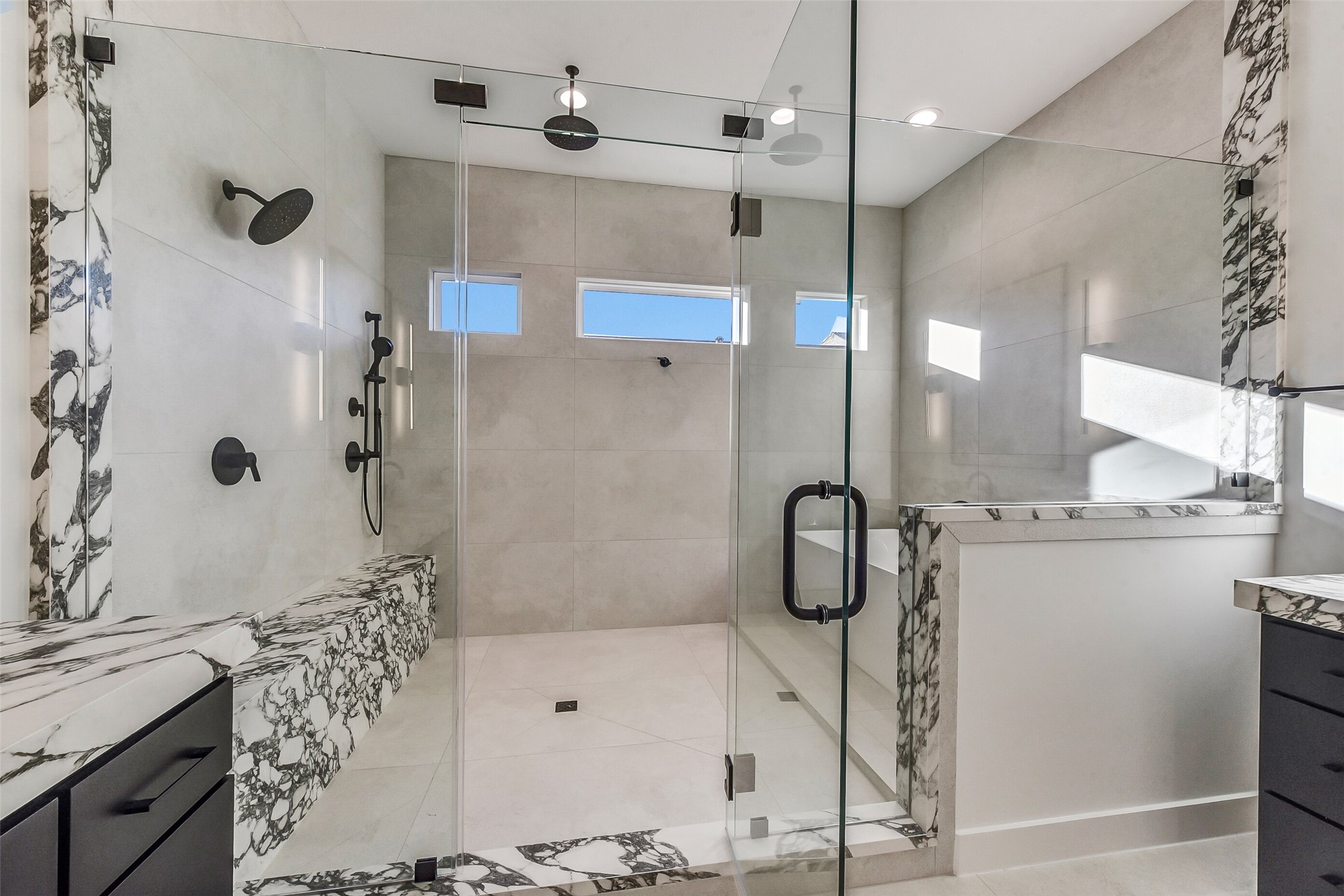 1902 Nantucket Drive Houston, TX 77057 - Photo 17 of 50 a bathroom with a tub sink and mirror