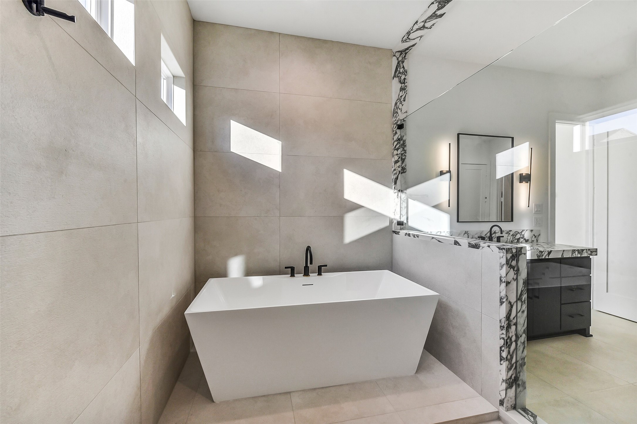 1902 Nantucket Drive Houston, TX 77057 - Photo 18 of 50 a bathroom with a bathtub and shower