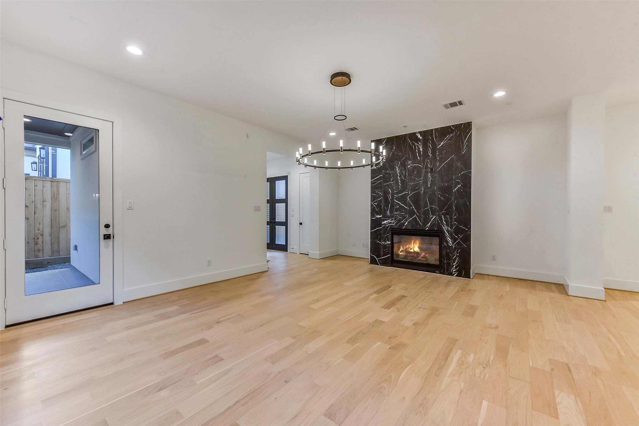 1902 Nantucket Drive Houston, TX 77057 - Photo 34 of 50 a view of an empty room with a fireplace