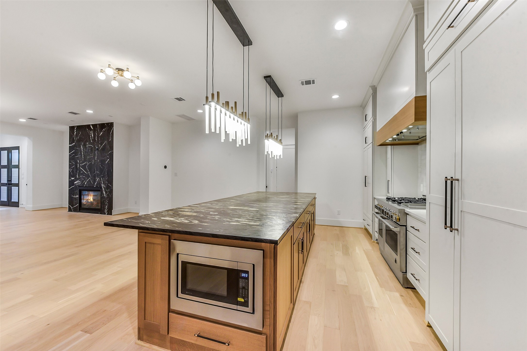 1902 Nantucket Drive Houston, TX 77057 - Photo 41 of 50 a kitchen with granite countertop a stove and a sink