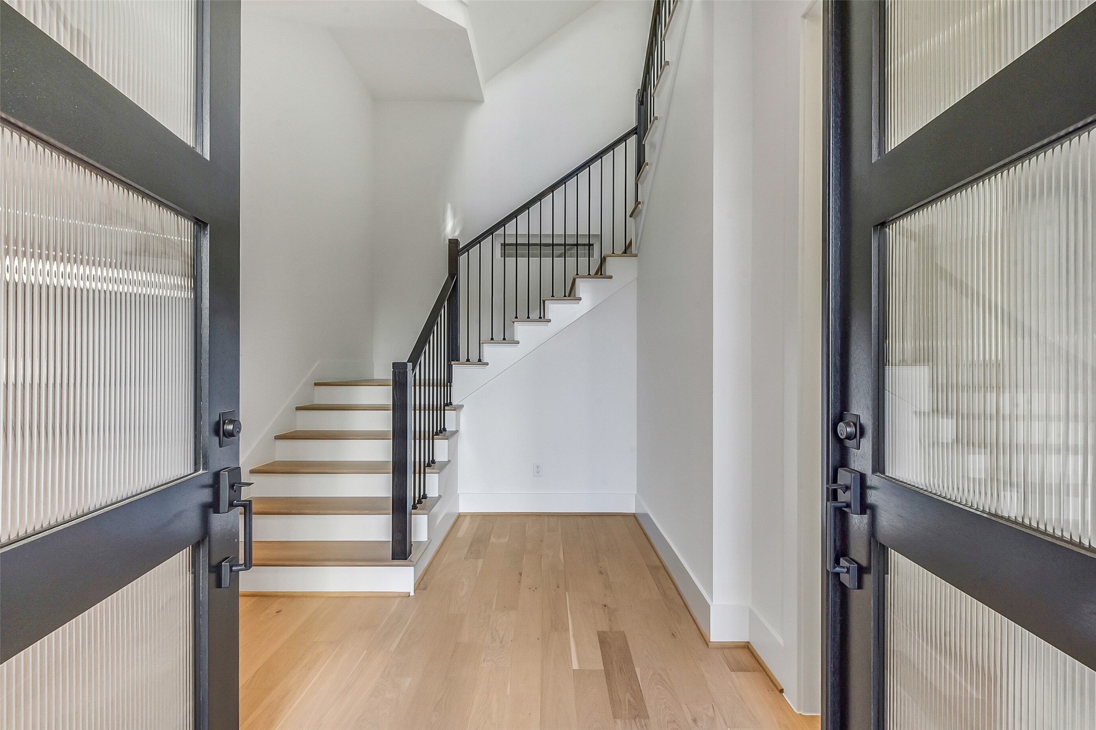 1902 Nantucket Drive Houston, TX 77057 - Photo 9 of 50 a view of entryway and hall with wooden floor