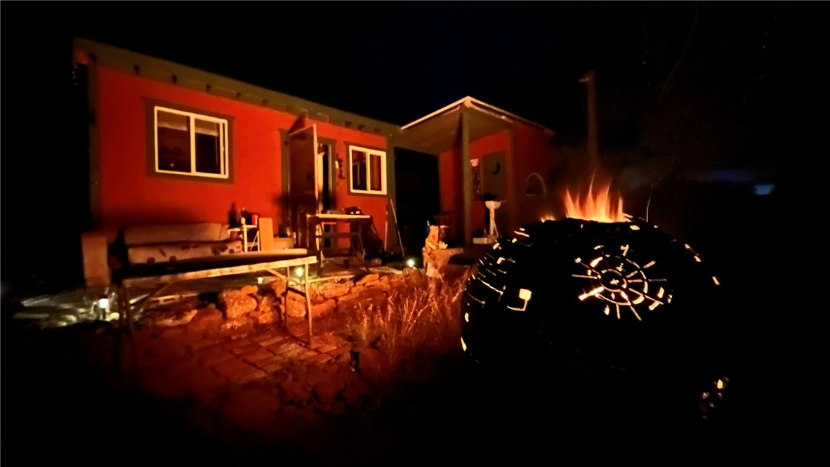 38 Acres Edge Ridge Road Seligman, AZ 86337 - Photo 8 of 45 Evening glow of the campfire lights the buildings