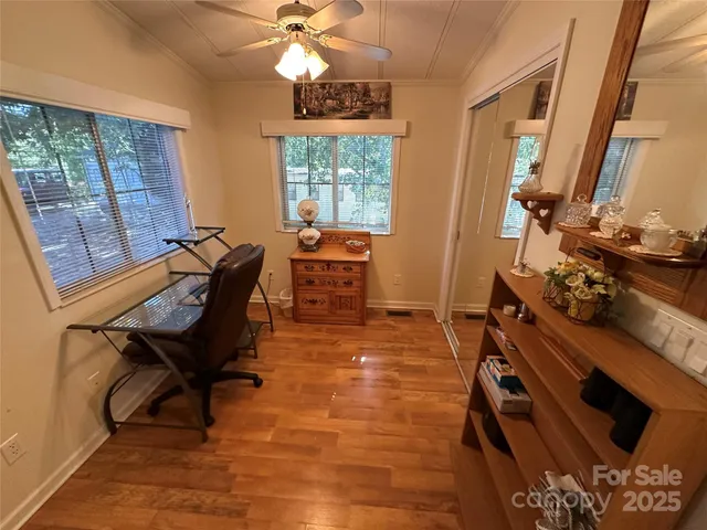 a room with furniture and wooden floor