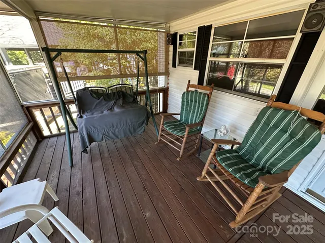 a view of living room with furniture and wooden floor
