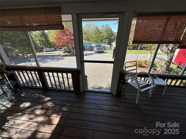 a view of a house with wooden fence