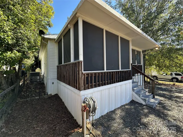a view of balcony with wooden floor