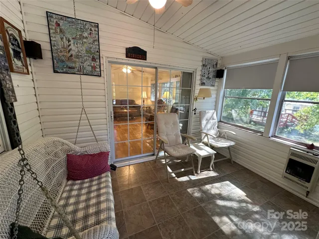 a building outdoor space with patio furniture and potted plants