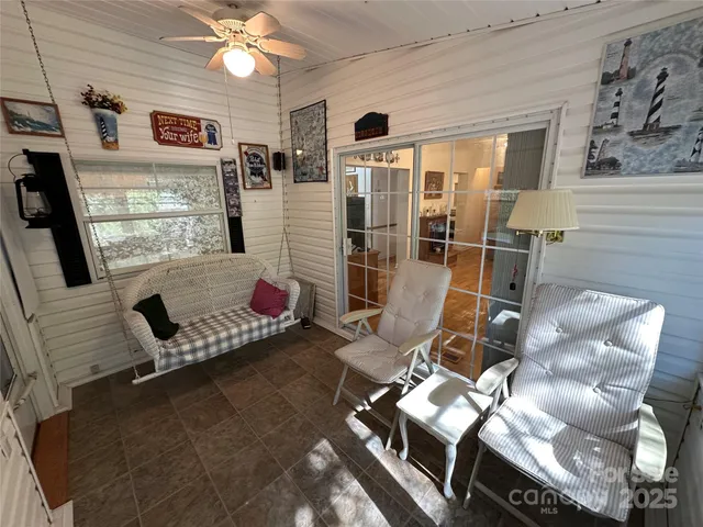a bedroom with furniture and a window